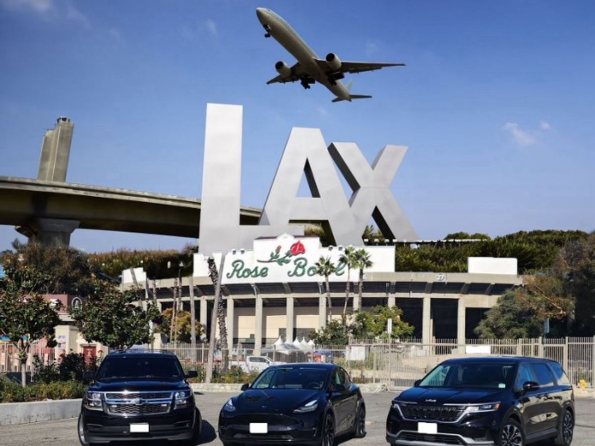 Wheels Up Connection fleet — three black vehicles in front of the LAX and Rose Bowl signs